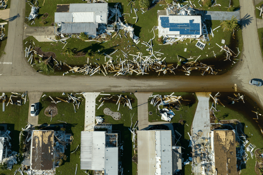 Aerial view of storm damaged homes in coastal neighborhood